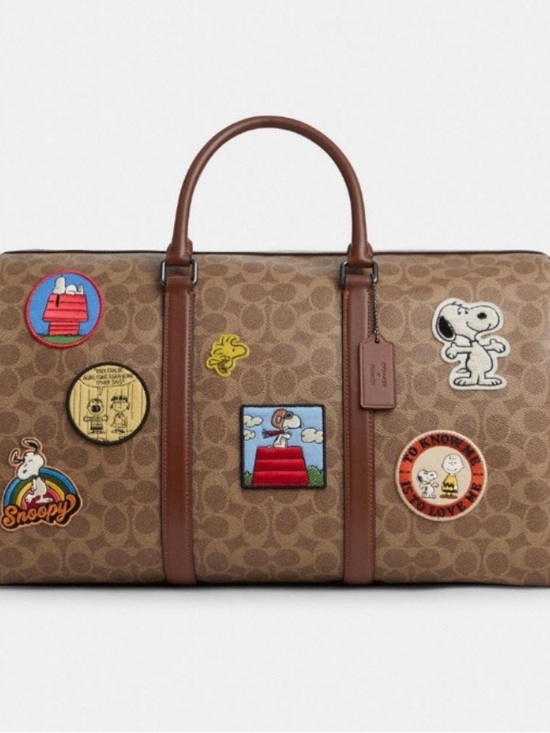 Coach Handbags - Coach Brown Signature Duffel with Peanuts Character Patches